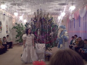 Watching the preformance at the kid's shelter.